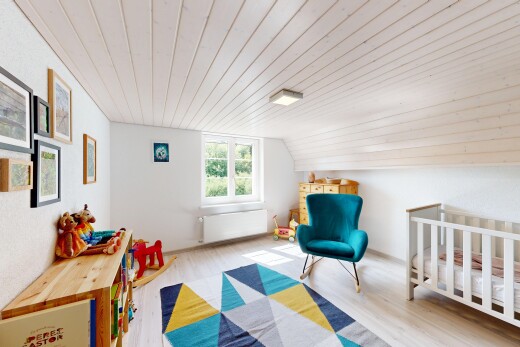 room / bedroom featuring radiator, light wood-style floors, a vaulted wooden ceiling, and a crib