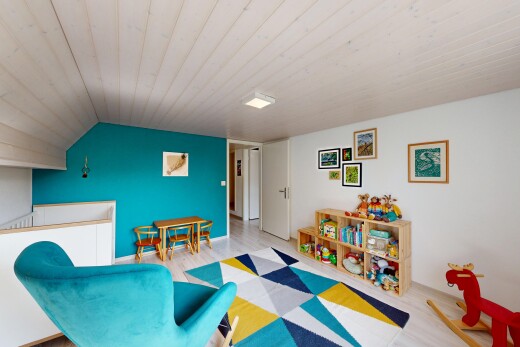 living area featuring light wood finished floors and a vaulted wooden ceiling