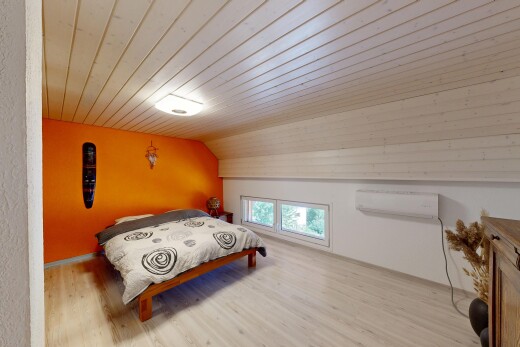 room featuring light wood-style floors and a vaulted wood ceiling