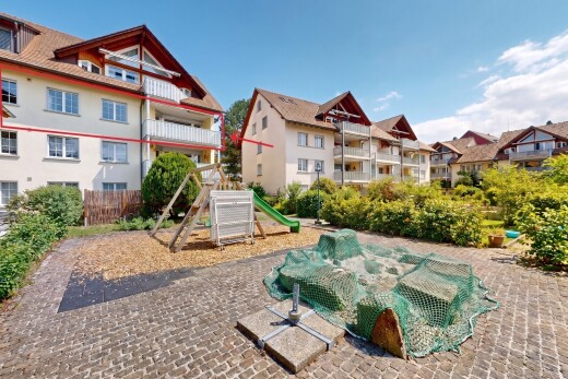 außenansicht mit from community, apartment complex view, spielplatz, day time, und dachgaube