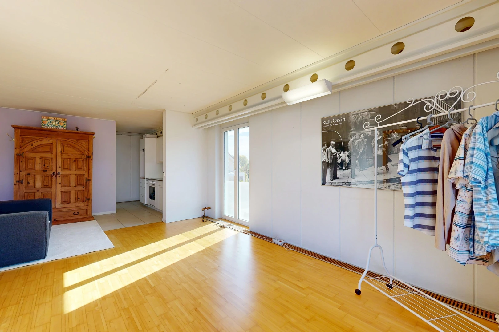 unfurnished room with light wood-type flooring and access to exterior