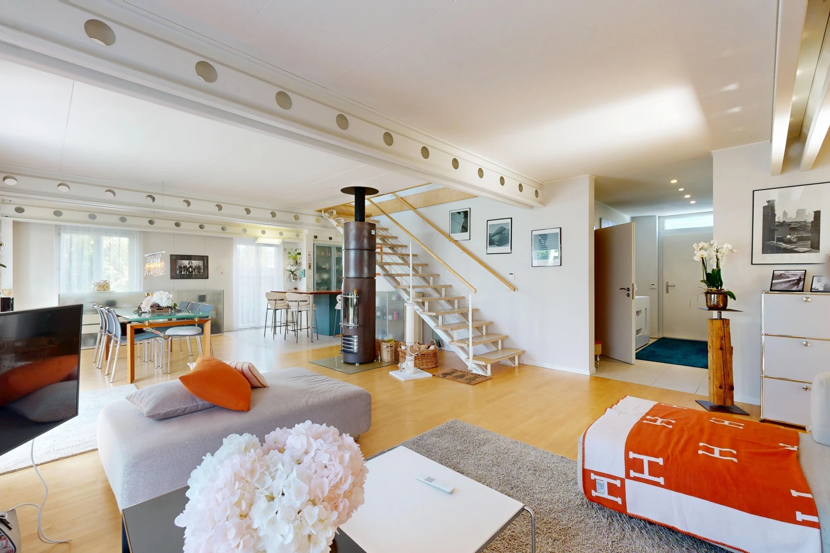 living room with stairs and light wood-style floors
