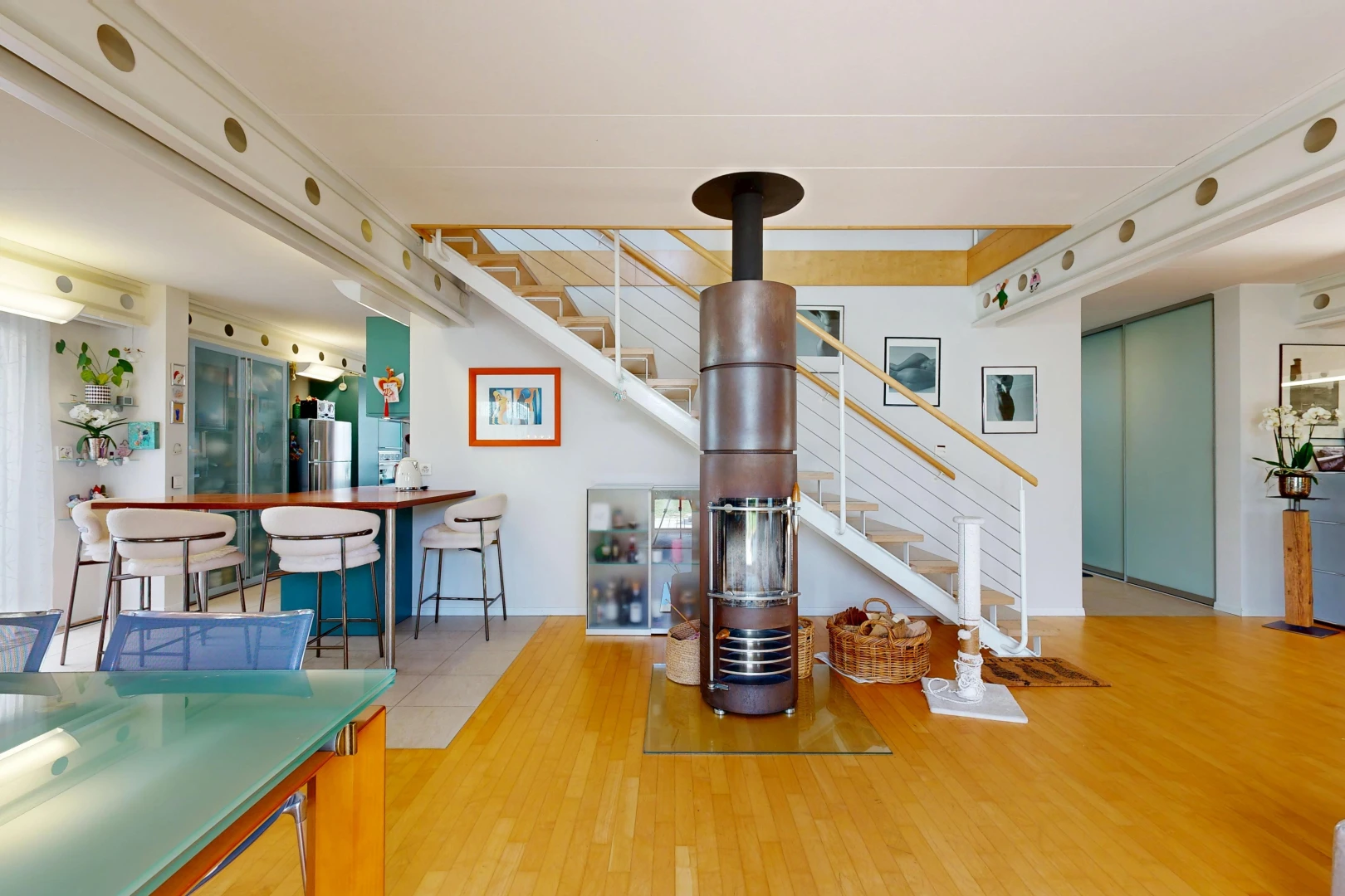 dining room with stairs and light wood finished floors