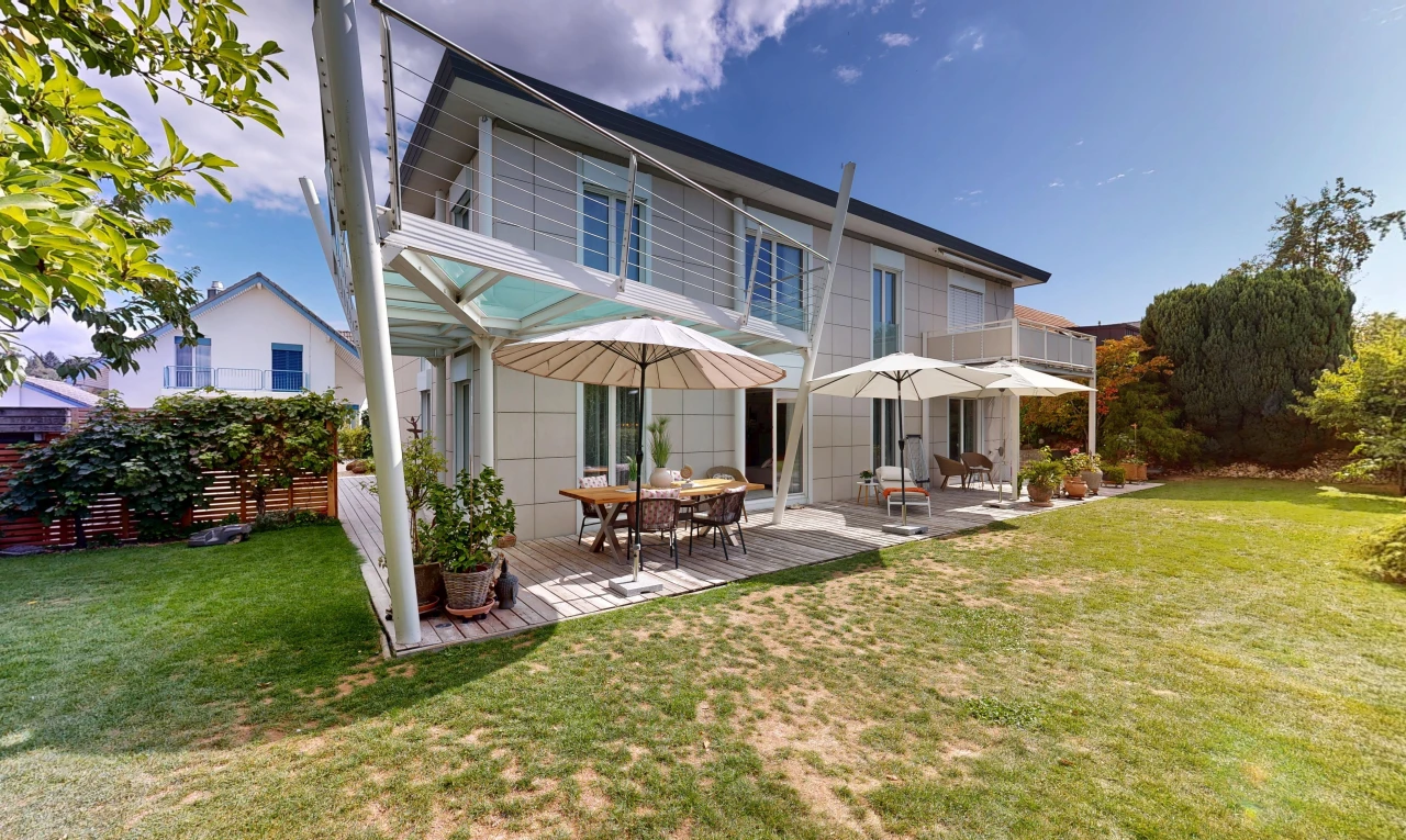 outdoor house with a yard and a deck