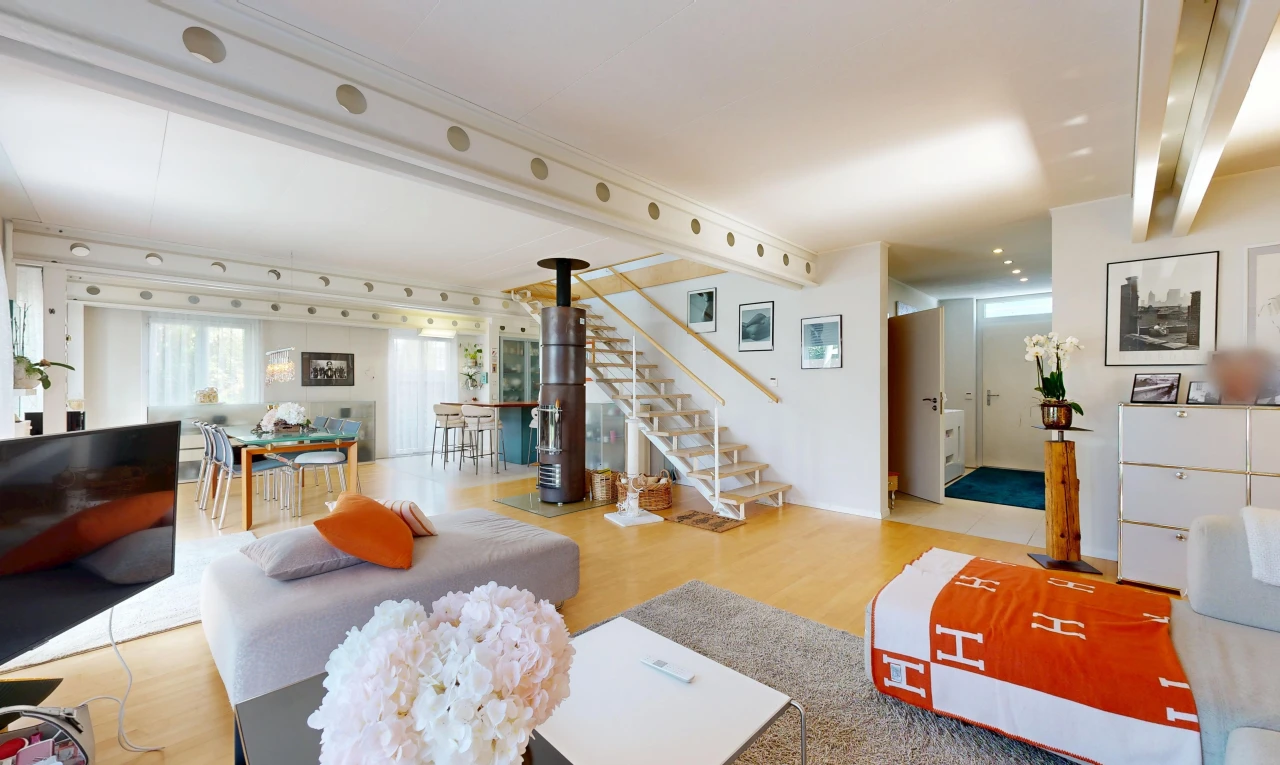 living room with stairs and light wood-style floors