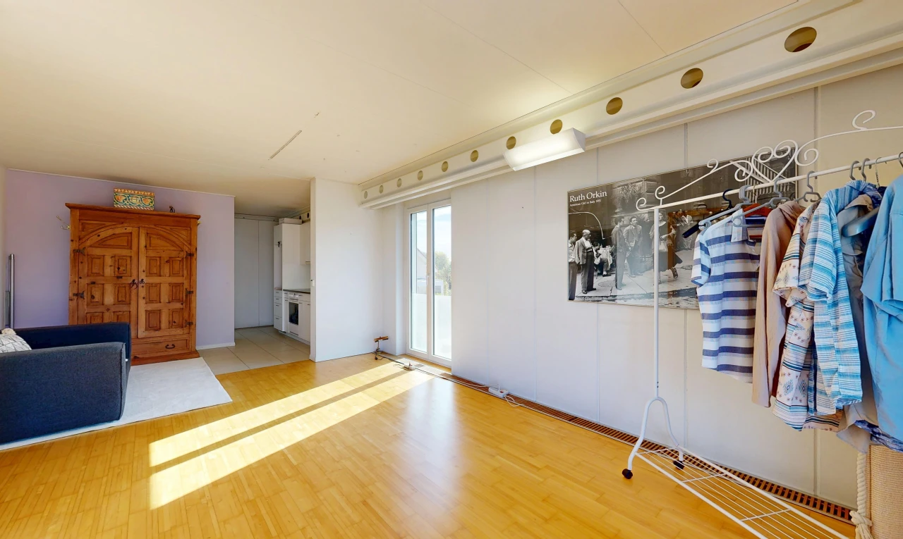 unfurnished room with light wood-type flooring and access to exterior