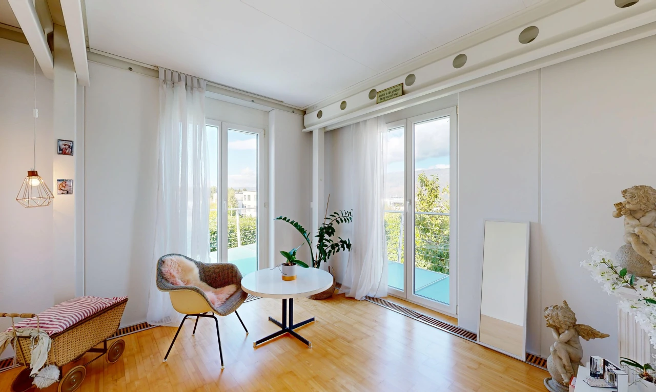 living area featuring light wood-style flooring and access to exterior