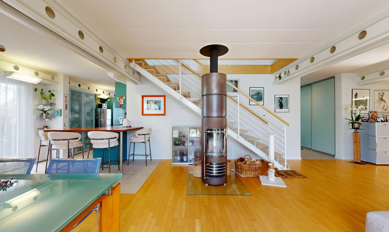 dining room with stairs and light wood finished floors
