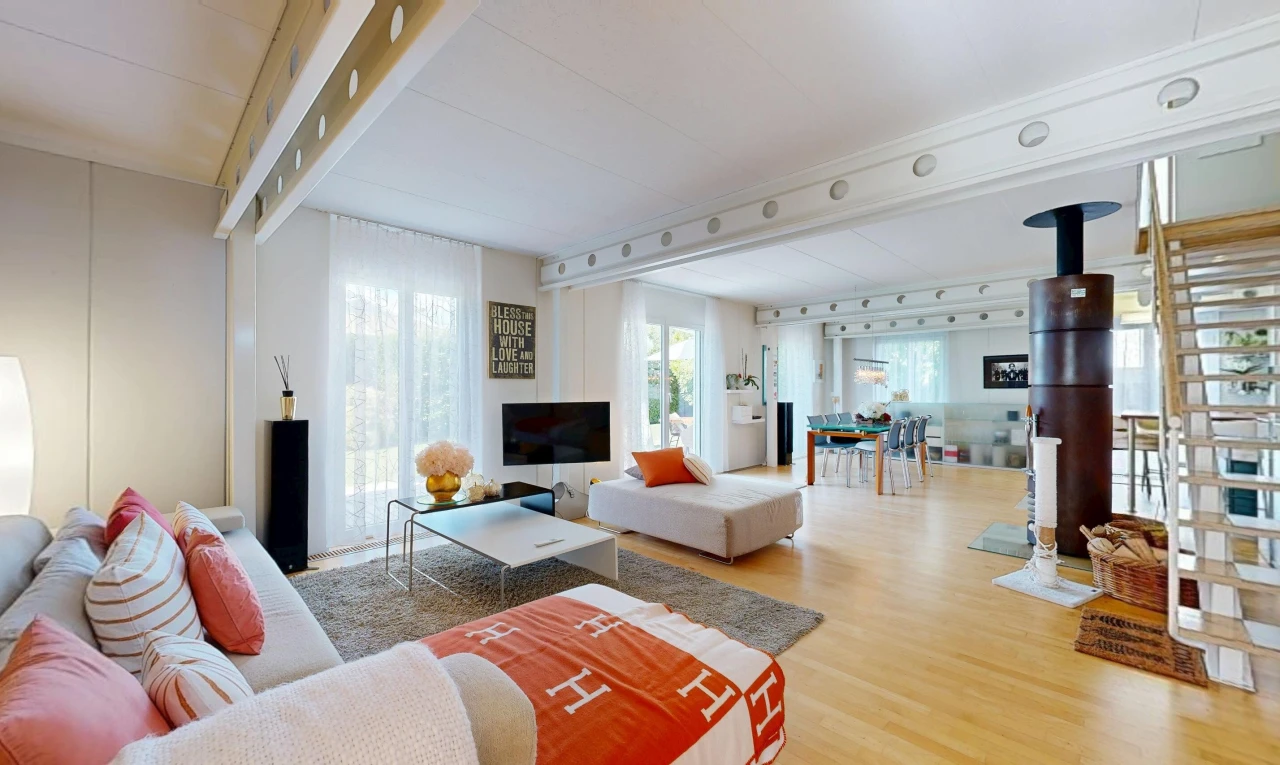living area featuring rail lighting, light wood-style flooring, and access to exterior