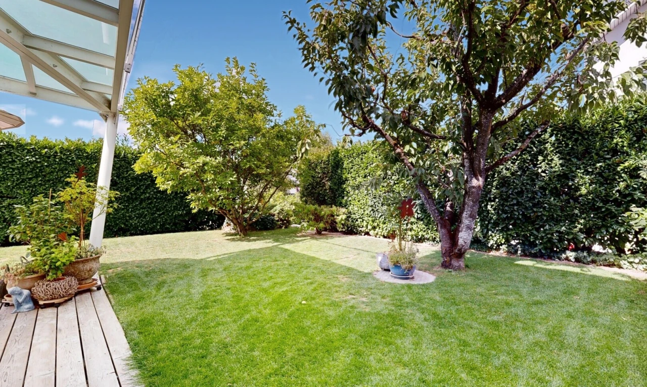garden featuring a yard and a deck