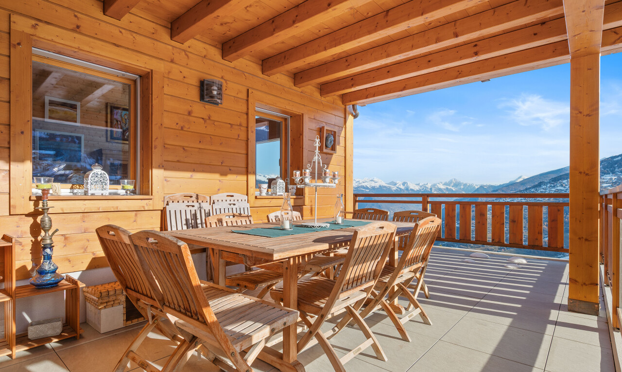 terrace featuring a mountain view, a patio area, and outdoor dining area