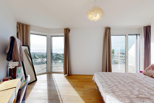 chambre avec accès à l'extérieur, sol en finition bois, wood finish floor, drywall, et inside property