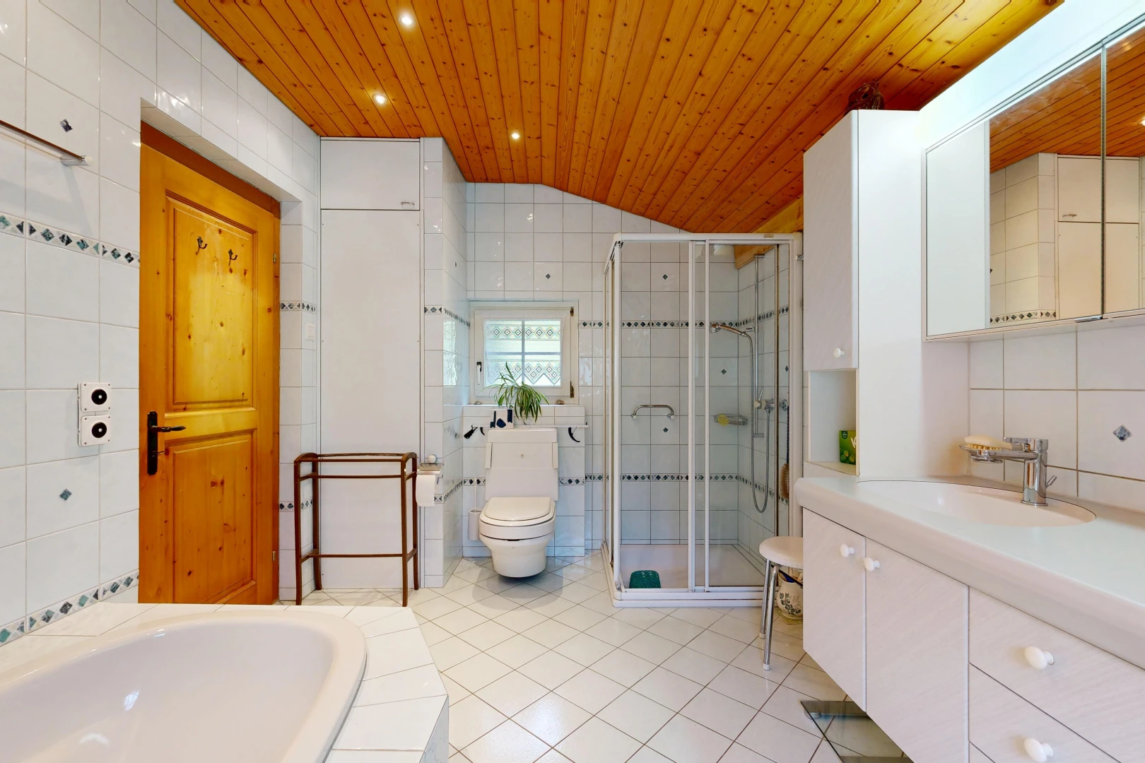 full bathroom featuring tile walls, a stall shower, vanity, a vaulted wooden ceiling, and a garden tub