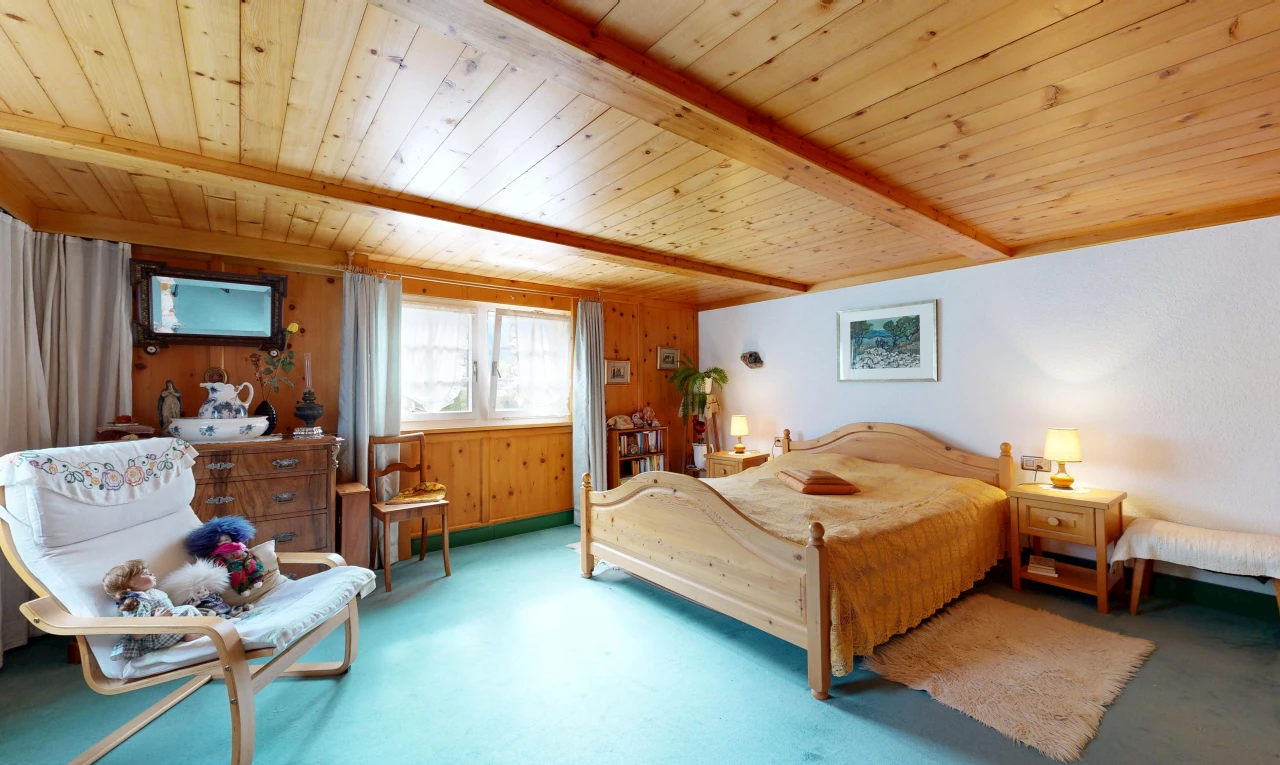 room featuring wood walls and a wooden ceiling with exposed beams
