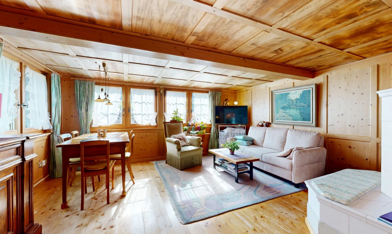living area featuring a wood ceiling with exposed beams, light wood-style flooring, and wood walls