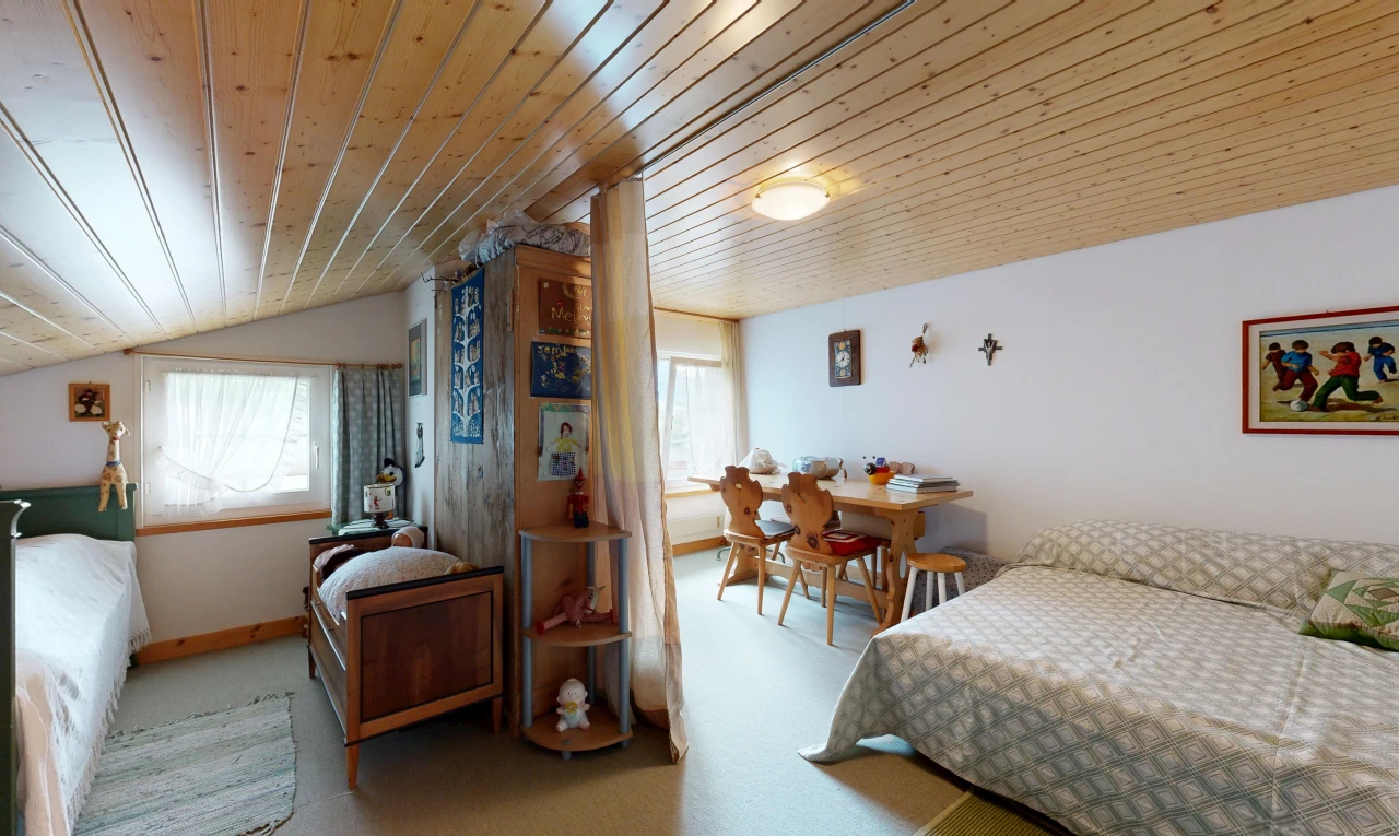 room featuring a vaulted wood ceiling, multiple windows, and light colored carpet