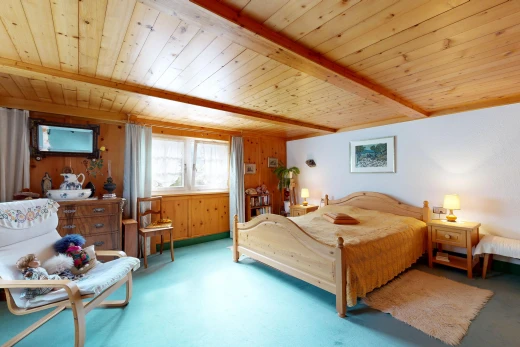 room featuring wood walls and a wooden ceiling with exposed beams
