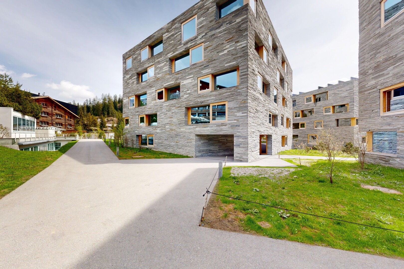 view of apartment building / complex with an attached garage