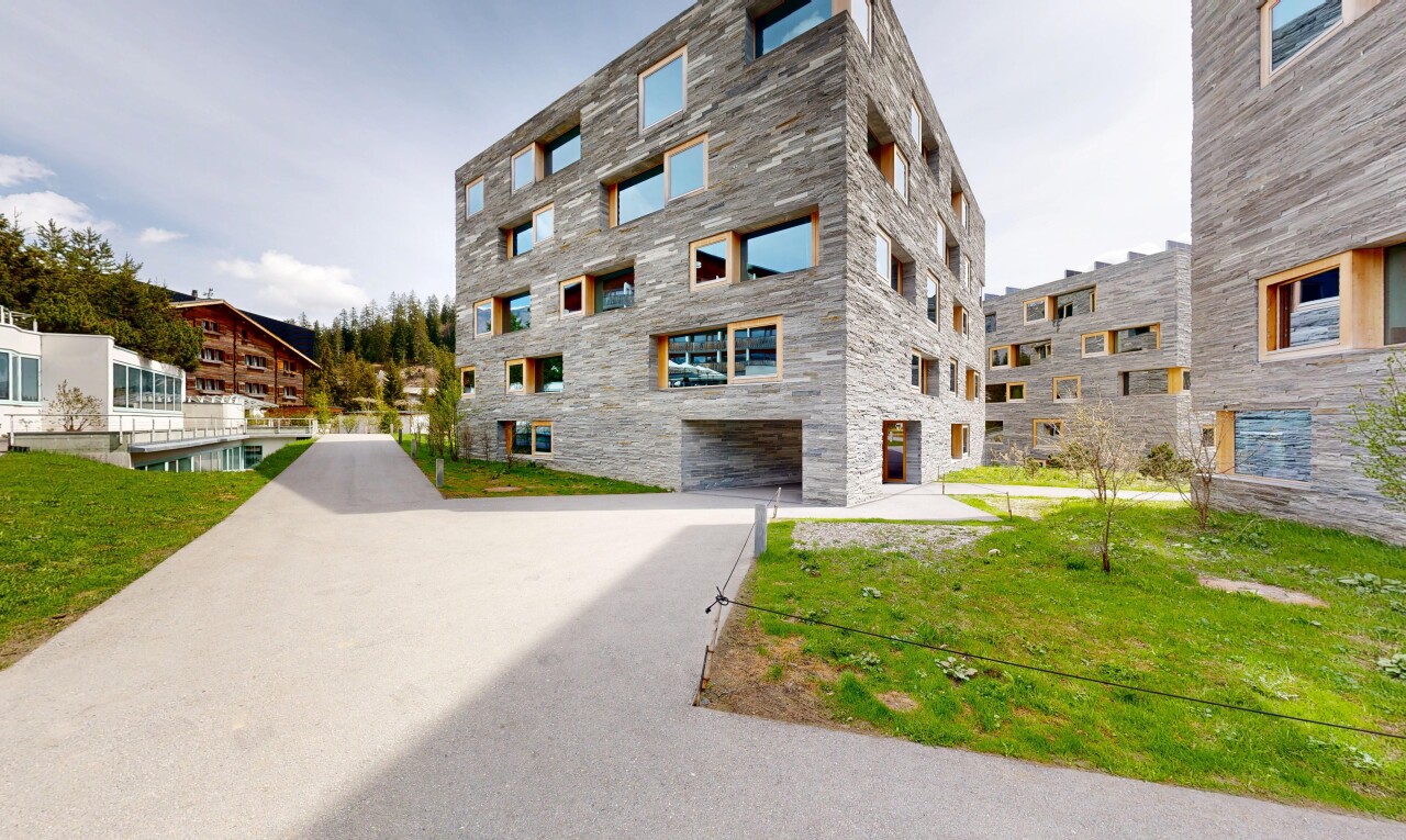 view of apartment building / complex with an attached garage