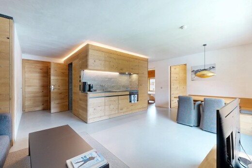 salon avec finished concrete floor, sol en béton, concrete floor, inside property, et light floor