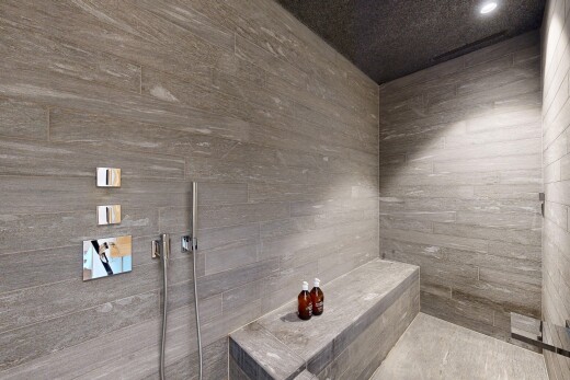 bathroom featuring tiled shower and recessed lighting