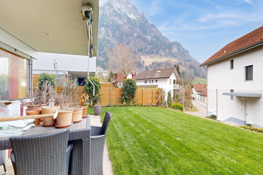patio / terrace with a fenced backyard, outdoor dining space, a mountain view, and a patio area