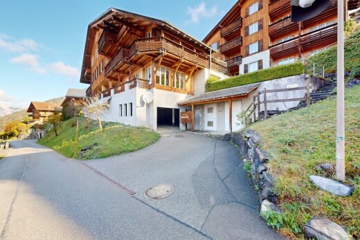 außenansicht mit day time, eingebaute garage, und balkon