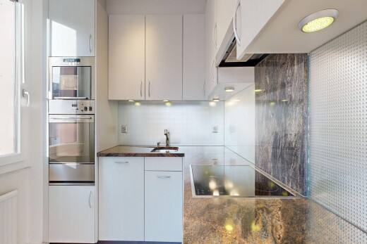 küche mit dark countertops, dunstabzugshaube, herd, inside property, und doppel backofen