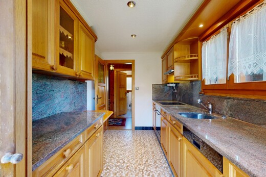 kitchen featuring glass fronted cabinets, open shelves, dark stone counters, dishwashing machine, and decorative backsplash
