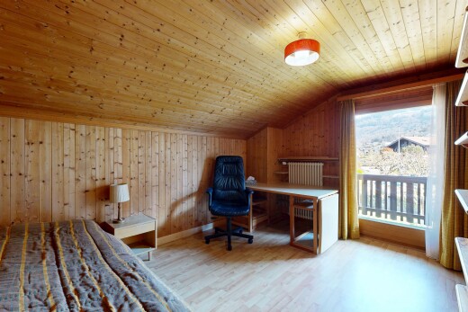 room with wood walls, light wood-style flooring, a vaulted wood ceiling, and a desk