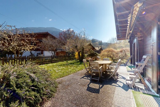 terrace with a patio area, outdoor dining area, and a mountain view