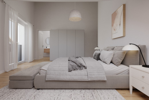 chambre avec salle de bains attenante, plancher de bois, et lumière naturelle