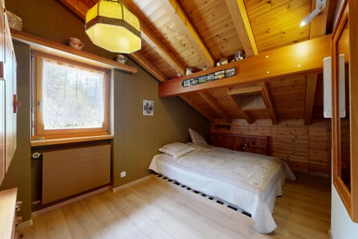 room with wooden walls, wooden ceiling, light wood finished floors, radiator heating unit, and lofted ceiling with beams
