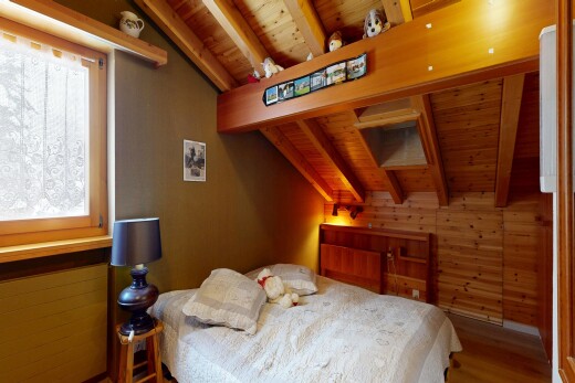 room / bedroom featuring wooden walls, wooden ceiling, lofted ceiling with beams, wood finished floors, and multiple windows