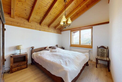 room featuring light wood-type flooring, wooden ceiling, lofted ceiling with beams, and suspended lighting