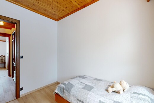 room with light wood-style flooring, wood ceiling, and crown molding