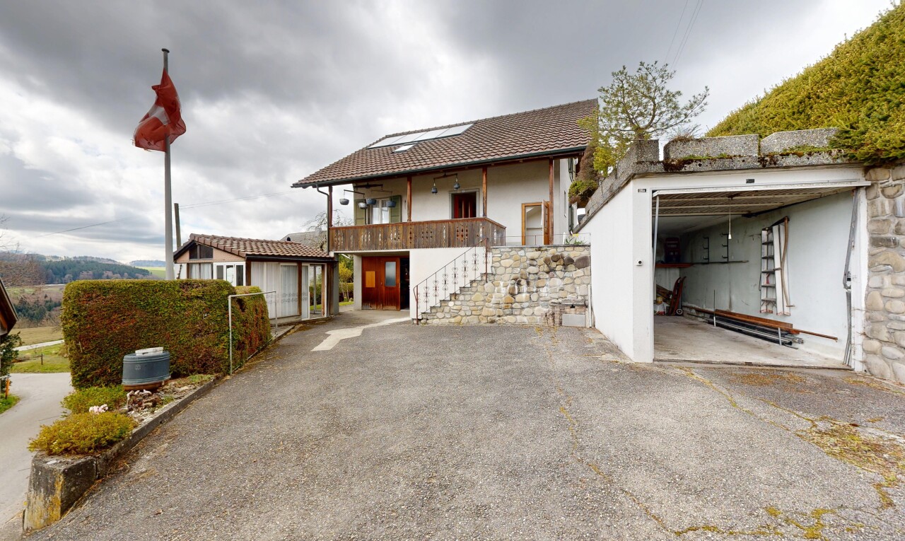view of property featuring a balcony, a patio area, and stucco siding