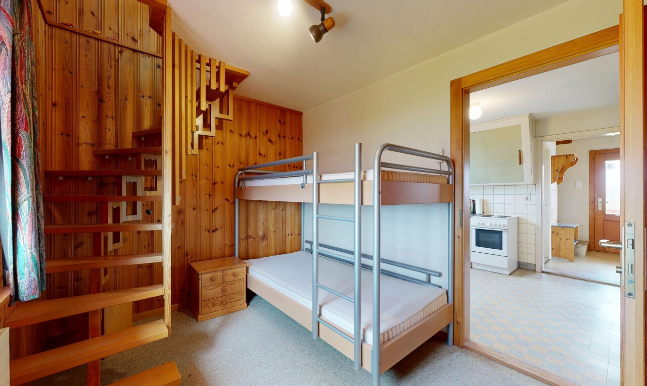 room featuring a baseboard radiator and light colored carpet