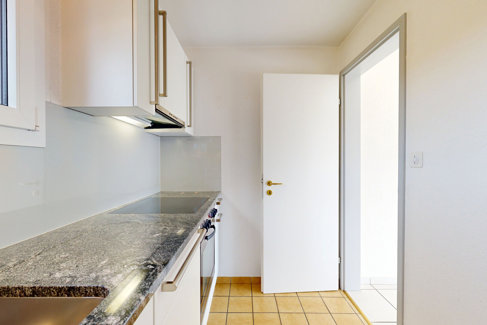 küche mit light floor, stone countertops, stein arbeitsplatten, white cabinets, und weiße schränke