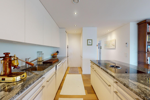 kitchen featuring dark stone counters, light wood-style floors, recessed lighting, black electric stovetop, and white cabinetry