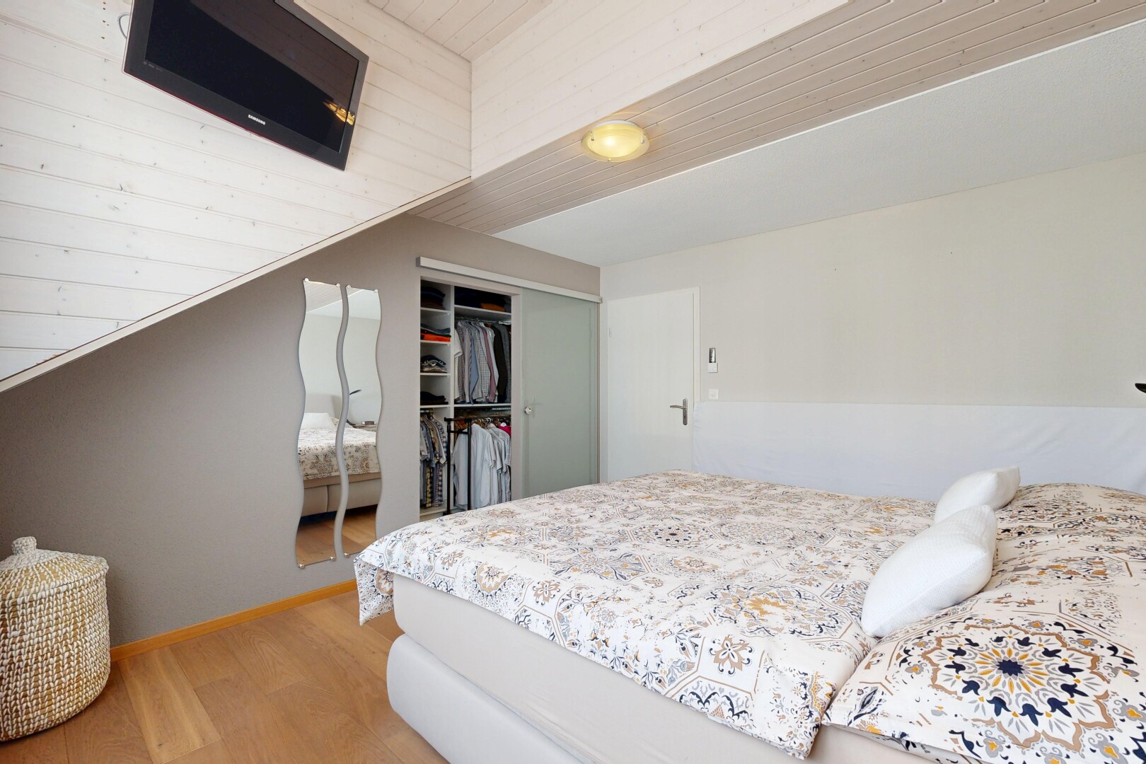 room featuring a closet and light wood-style floors