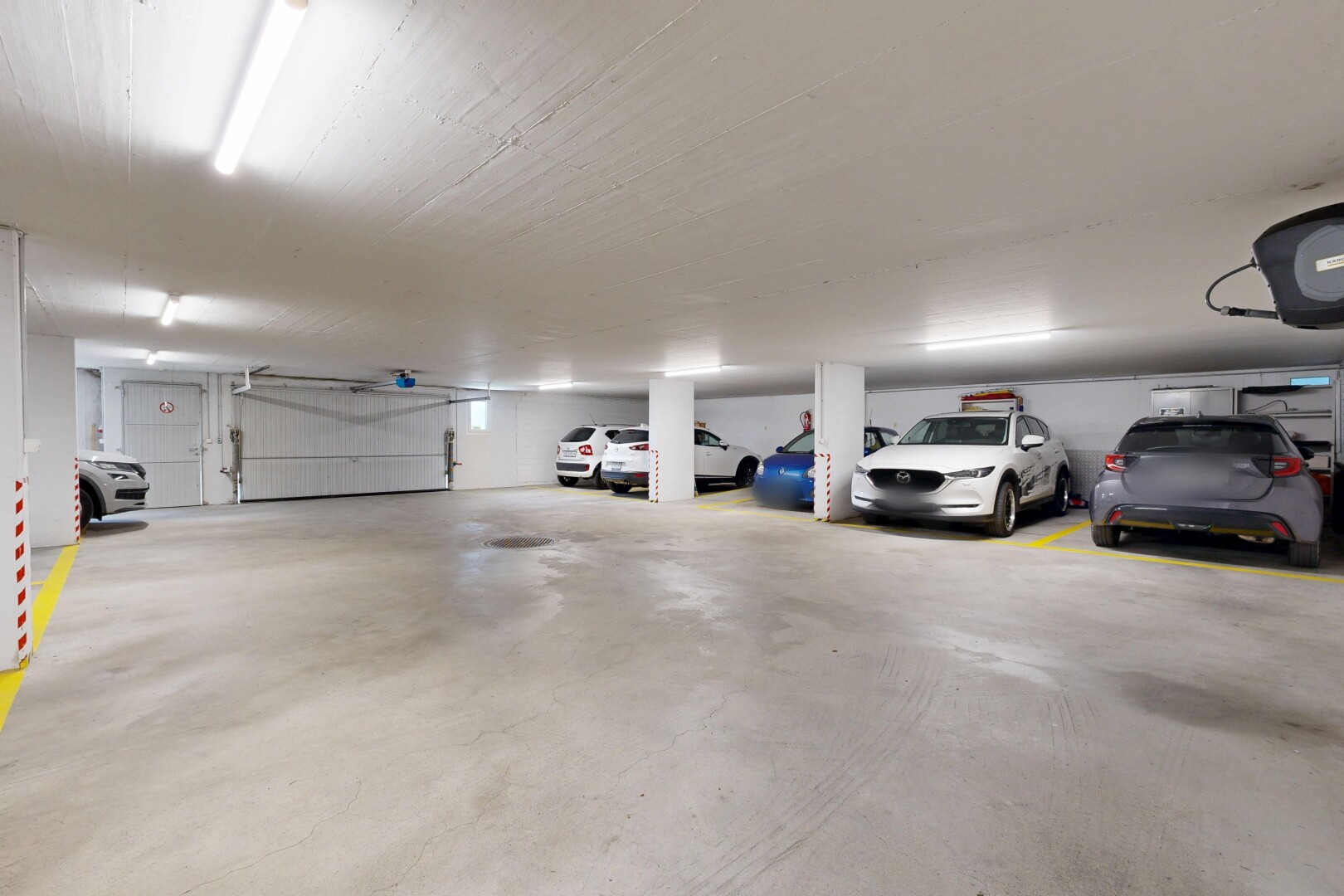 view of parking with a parking deck