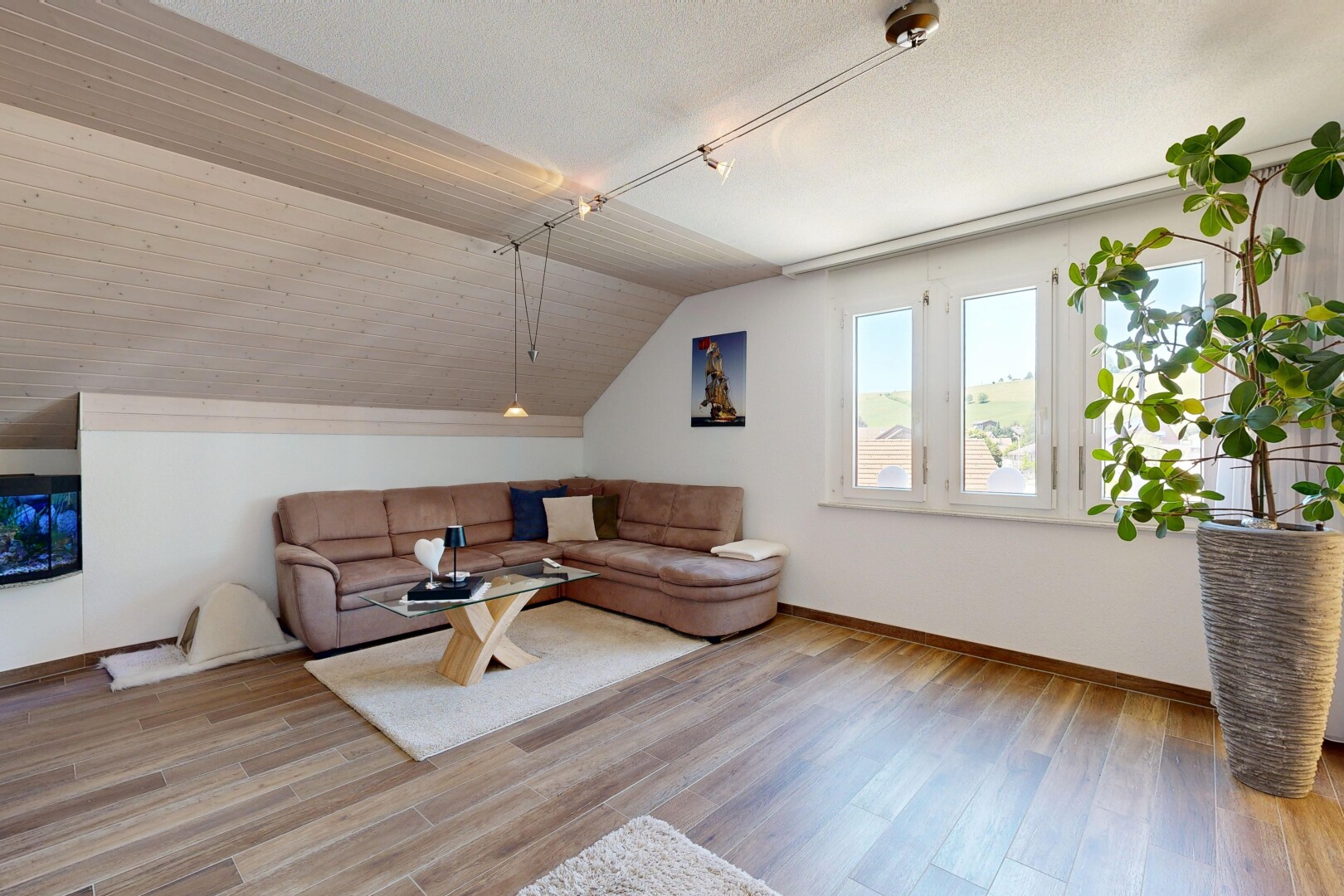living area featuring vaulted ceiling and light wood finished floors