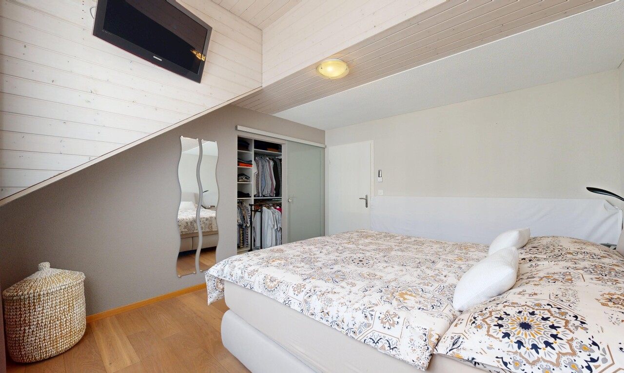 room featuring a closet and light wood-style floors