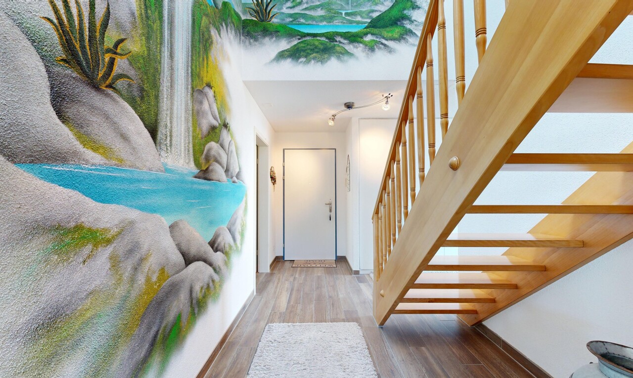 staircase featuring wood finished floors