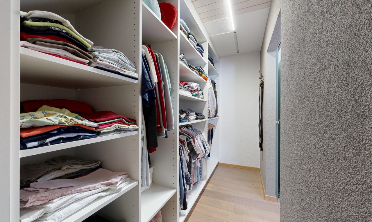 walk in closet with a spacious closet and light wood-style flooring