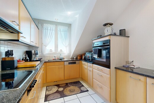 küche mit dark countertops, ofen, light floor, herd, und tile floor