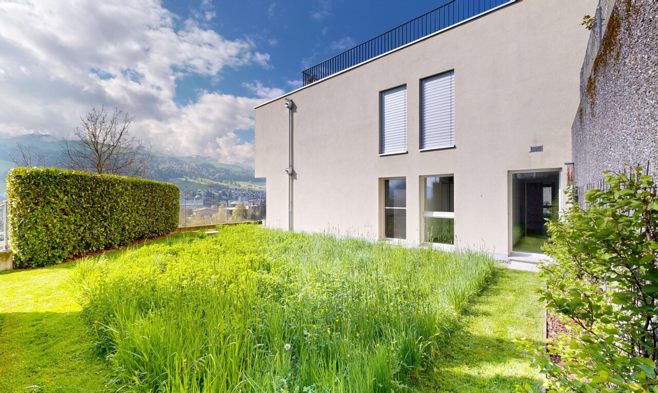façade avec property visible, bardage en stuc, et day time