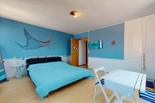 bedroom with wood-type flooring