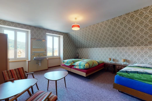 carpeted bedroom featuring natural light